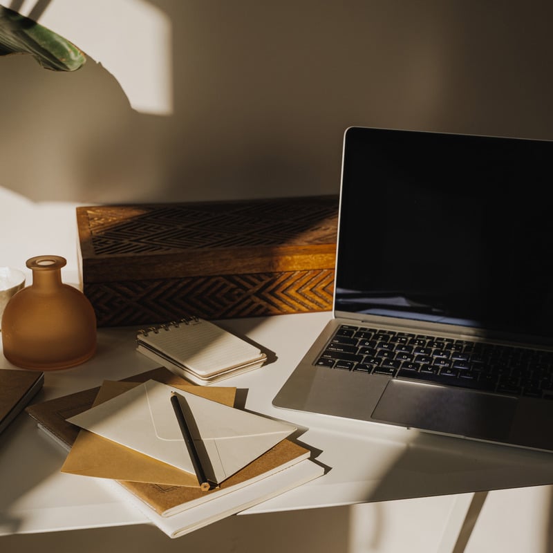 Desk with laptop, notebook and stationery flat lay